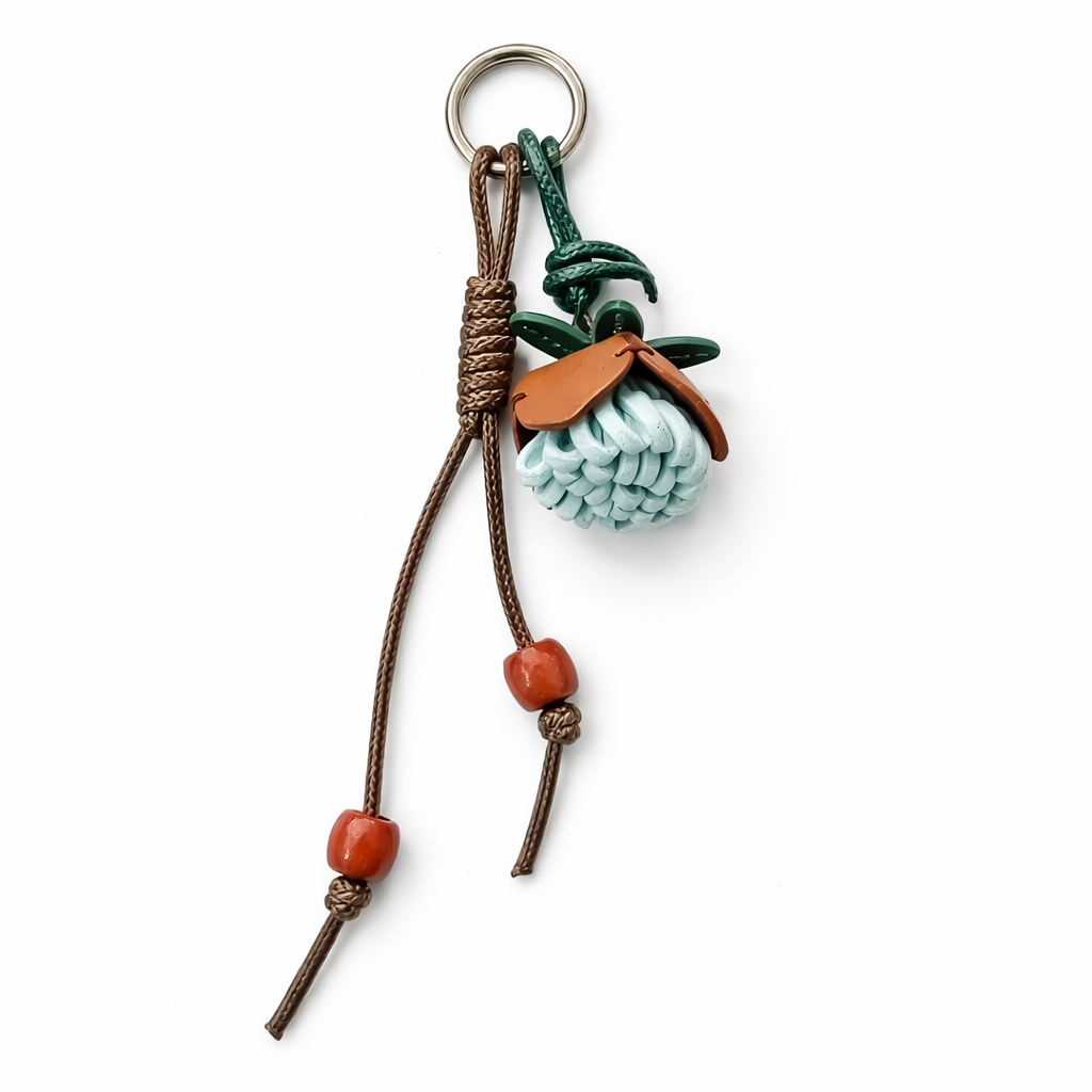 Breloque de sac à main avec pompon fleuri pour femme, porte-clés haut de gamme en cuir PU, pendentif en corde tressée avec pomme de pin et fleur.