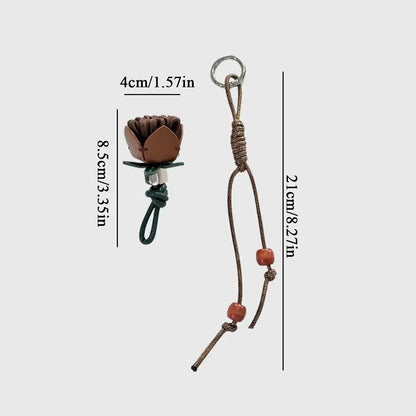 Breloque de sac à main avec pompon fleuri pour femme, porte-clés haut de gamme en cuir PU, pendentif en corde tressée avec pomme de pin et fleur.